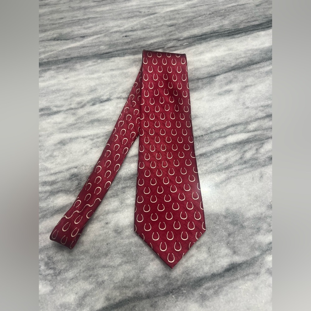 Circle Neckwear by Sidran 100% silk tie in red with a white horseshoe pattern